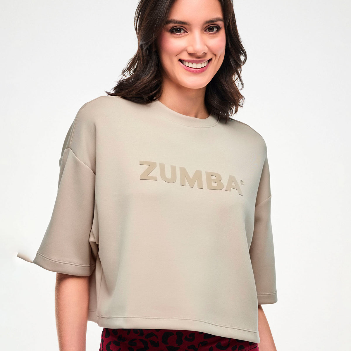 Beżowa koszulka z obniżoną linią ramion — Zumba Wear FW26 Modal